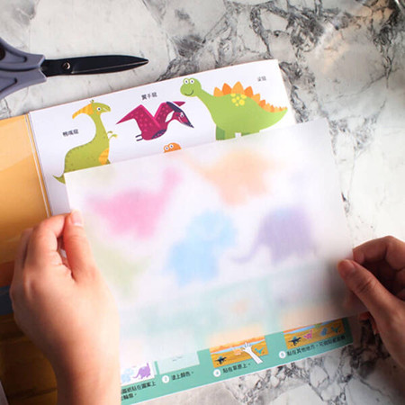 Książeczka do zabawy w tworzenie naklejek kalkomania Dinozaury