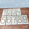 Drewniane tabliczki z cyframi do nauki pisania po śladzie